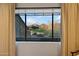 Enjoy views of the desert landscape from the bedroom window with neutral draperies at 9270 E Thompson Peak Pkwy # 347, Scottsdale, AZ 85255