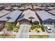 Stunning aerial view of the home with lush landscaping and solar panels highlighting its curb appeal at 9624 E Thunderbolt Ave, Mesa, AZ 85212