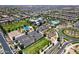 Aerial view highlights a community pool, clubhouse, and playground, creating a Gathering-friendly atmosphere with many amenities at 9624 E Thunderbolt Ave, Mesa, AZ 85212