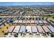 Scenic aerial view of a residential neighborhood with diverse home styles and desert landscaping at 9624 E Thunderbolt Ave, Mesa, AZ 85212