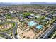 Beautiful aerial view of community pool, clubhouse, and surrounding neighborhood, perfect for Gathering fun and community gatherings at 9624 E Thunderbolt Ave, Mesa, AZ 85212