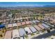 Expansive aerial shot of a suburban community showcasing well-maintained homes and streets at 9624 E Thunderbolt Ave, Mesa, AZ 85212