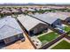Aerial view of a well-maintained backyard with artificial turf, seating area, and built-in grill at 9624 E Thunderbolt Ave, Mesa, AZ 85212