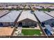 Aerial view showcasing a tidy backyard with artificial turf, patio furniture, and barbecue setup at 9624 E Thunderbolt Ave, Mesa, AZ 85212