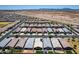 High-angle aerial view of a suburban neighborhood with similar houses and well-kept yards at 9624 E Thunderbolt Ave, Mesa, AZ 85212