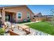 Inviting backyard featuring a well-maintained artificial lawn, outdoor seating, and a built-in barbecue area at 9624 E Thunderbolt Ave, Mesa, AZ 85212