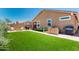 Large artificial lawn with outdoor seating and a barbecue, perfect for relaxation and outdoor entertainment at 9624 E Thunderbolt Ave, Mesa, AZ 85212