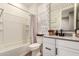 Fresh bathroom with white vanity, stylish mirror, and shower-tub combination at 9624 E Thunderbolt Ave, Mesa, AZ 85212
