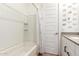 The full bathroom offers a shower-tub combination with white subway tile surround and modern fixtures at 9624 E Thunderbolt Ave, Mesa, AZ 85212