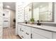 This bathroom showcases a dual sink vanity with contemporary fixtures and a tile backsplash at 9624 E Thunderbolt Ave, Mesa, AZ 85212