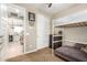 Cozy bedroom boasts a bunk bed, closet, and playful wall decor, leading to a bright, modern kitchen at 9624 E Thunderbolt Ave, Mesa, AZ 85212