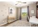 Cozy bedroom with neutral decor, a ceiling fan, and a window with natural light at 9624 E Thunderbolt Ave, Mesa, AZ 85212