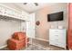 The bedroom features a bunk bed, neutral colors, and an artistic accent wall at 9624 E Thunderbolt Ave, Mesa, AZ 85212