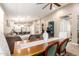 Open floor plan dining room, flowing to the kitchen and living room at 9624 E Thunderbolt Ave, Mesa, AZ 85212