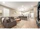 Open concept living space features a large seating area, kitchen with bar seating and tiled floors at 9624 E Thunderbolt Ave, Mesa, AZ 85212