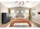 Comfortable main bedroom offers a calming color palette, soft carpet and dual windows at 9624 E Thunderbolt Ave, Mesa, AZ 85212