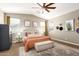A spacious main bedroom features a vaulted ceiling, ceiling fan, and neutral-toned decor for a serene retreat at 9624 E Thunderbolt Ave, Mesa, AZ 85212
