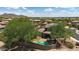 Aerial view of the home with backyard pool, outdoor living space, and mature shade trees at 9904 E South Bend Dr, Scottsdale, AZ 85255