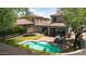 Well-maintained backyard showcasing a sparkling pool, covered patio, and lush landscaping, perfect for outdoor enjoyment at 9904 E South Bend Dr, Scottsdale, AZ 85255