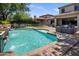 Lush backyard includes a sparkling pool, comfortable seating, and a trampoline providing an ideal outdoor retreat at 9904 E South Bend Dr, Scottsdale, AZ 85255