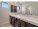 Bathroom with double vanity and dark wood cabinetry at 9904 E South Bend Dr, Scottsdale, AZ 85255