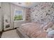Charming bedroom featuring floral wallpaper, white trim, and a cozy shag rug at 9904 E South Bend Dr, Scottsdale, AZ 85255