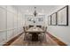 Formal dining room with a decorative chandelier, wainscoting, and ample seating for dinner parties at 9904 E South Bend Dr, Scottsdale, AZ 85255