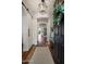 Welcoming entryway with hardwood floors, a decorative wreath, and an open floor plan at 9904 E South Bend Dr, Scottsdale, AZ 85255