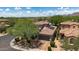 Beautiful two-story home with lush landscaping, a two-car garage, and a tile roof at 9904 E South Bend Dr, Scottsdale, AZ 85255