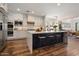 Modern kitchen featuring white cabinets, stainless steel appliances, and a large central island at 9904 E South Bend Dr, Scottsdale, AZ 85255