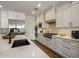 Well-lit kitchen with an island, stainless steel appliances, modern cabinetry, and stone backsplash at 9904 E South Bend Dr, Scottsdale, AZ 85255