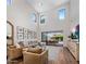Bright living room with large windows, hardwood floors, and stylish furniture at 9904 E South Bend Dr, Scottsdale, AZ 85255
