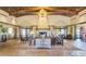 Expansive lobby with decorative fireplace, exposed beam ceiling, and tiled flooring at 9904 E South Bend Dr, Scottsdale, AZ 85255