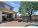 Spacious outdoor patio with comfortable seating area, dining table, and a view of the refreshing pool at 9904 E South Bend Dr, Scottsdale, AZ 85255