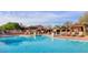 Stunning community pool area with ample seating, shaded cabanas, and sparkling water at 9904 E South Bend Dr, Scottsdale, AZ 85255