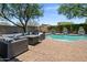 Beautiful backyard pool with lush landscaping, soothing water features, and relaxing outdoor seating area at 9904 E South Bend Dr, Scottsdale, AZ 85255