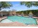 Inviting pool features vibrant landscaping and charming water features that enhance the backyard's tranquility at 9904 E South Bend Dr, Scottsdale, AZ 85255