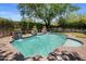 Backyard pool with serene water features, surrounded by lush greenery, provides a relaxing and private oasis at 9904 E South Bend Dr, Scottsdale, AZ 85255