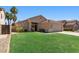 A charming single-story house featuring a green lawn, and a desert landscape at 1029 E Jasper Dr, Gilbert, AZ 85296