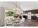 Eat-in kitchen with dark wood cabinets, modern appliances, and access to the patio at 1029 E Jasper Dr, Gilbert, AZ 85296