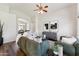 Open-concept living area featuring hardwood floors, neutral colors, and archway at 1029 E Jasper Dr, Gilbert, AZ 85296