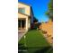 Backyard putting green with synthetic turf and desert landscaping, perfect for outdoor fun at 1100 S 176Th Ave, Goodyear, AZ 85338