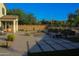 Backyard with pool and lounge chairs surrounded by patio and landscaped area at 1100 S 176Th Ave, Goodyear, AZ 85338