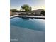 Relaxing backyard pool with clean water, a water feature, and decorative landscaping at 1100 S 176Th Ave, Goodyear, AZ 85338