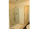 Bright bathroom features a glass-enclosed shower and a neutral color palette at 1100 S 176Th Ave, Goodyear, AZ 85338
