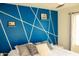 Stylish bedroom features a bold accent wall and plush bedding at 1100 S 176Th Ave, Goodyear, AZ 85338