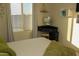 Bedroom showcasing a modern vanity, bright window, and geometric wall art at 1100 S 176Th Ave, Goodyear, AZ 85338