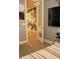 Modern bedroom with a view into a uniquely decorated area, and sleek tiled floors at 1100 S 176Th Ave, Goodyear, AZ 85338