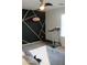 Bedroom with a modern design featuring a geometric accent wall and exercise equipment at 1100 S 176Th Ave, Goodyear, AZ 85338