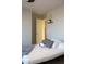 Bedroom with a view into the hallway featuring a decorative shelf and modern decor at 1100 S 176Th Ave, Goodyear, AZ 85338